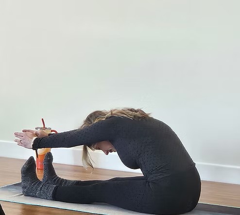 Seated forward fold demonstrating flexibility